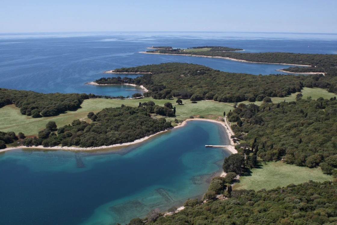 National park Brijuni are a group of fourteen small islands in the Croatia part of the northern Adriatic Sea , bay Verige with old Roman monuments - aerial view